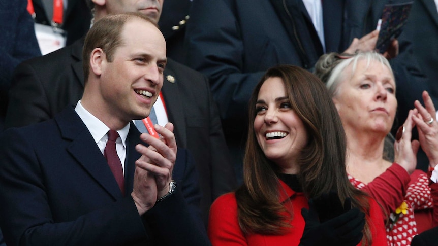 Prince William and Kate Middleton watch a rugby match at the Stade de France stadium.