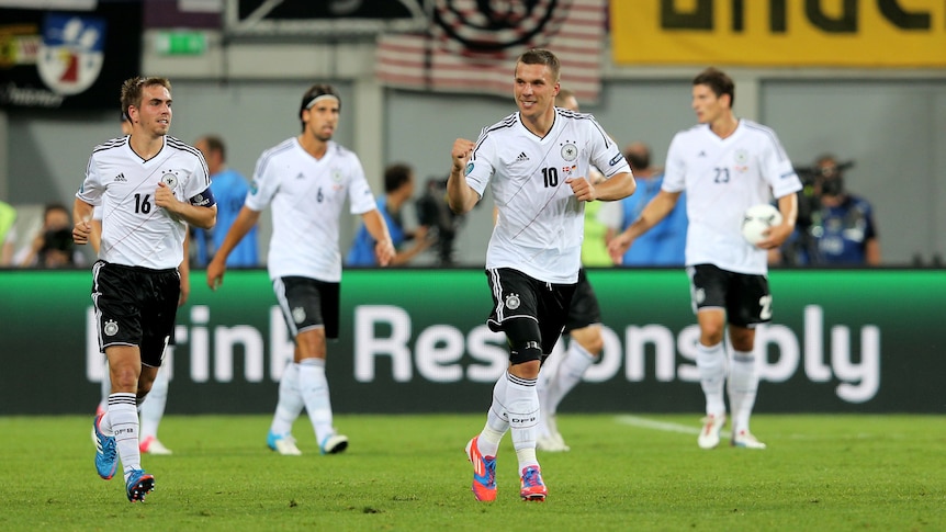 Podolski celebrates his goal against Denmark