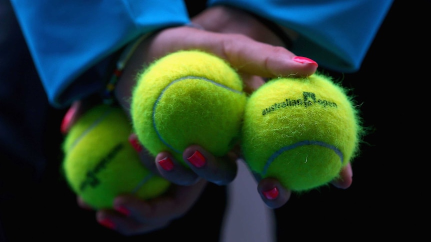 Ball-kid stands at the ready