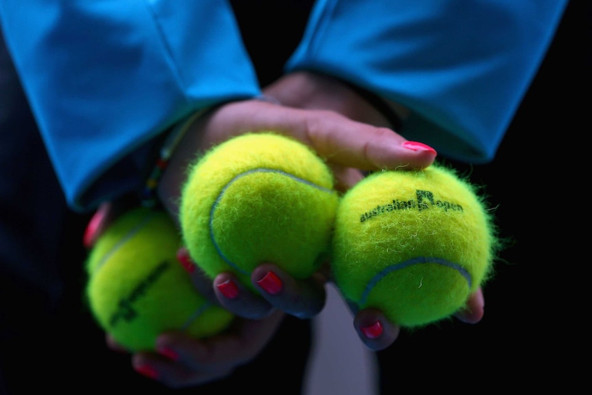 Ball-kid stands at the ready