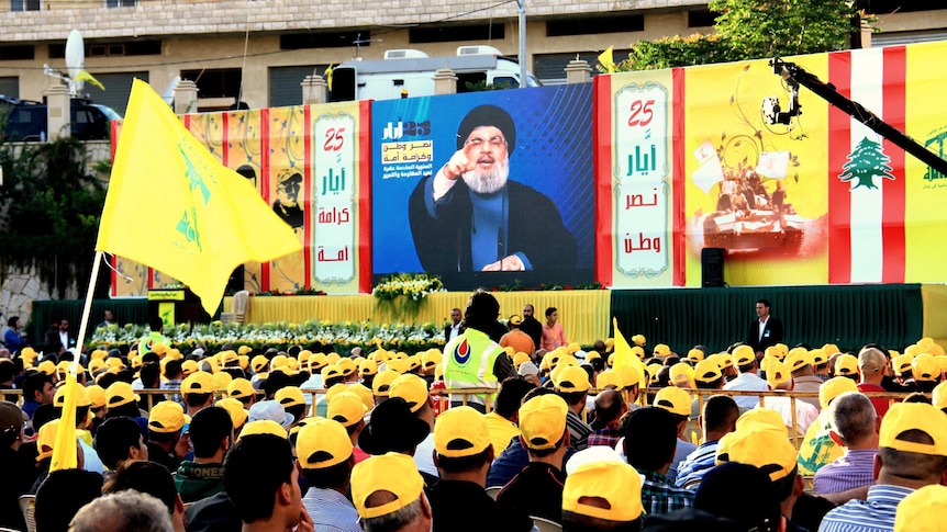 Nasrallah speaking to Hezbollah supporters via a giant screen.