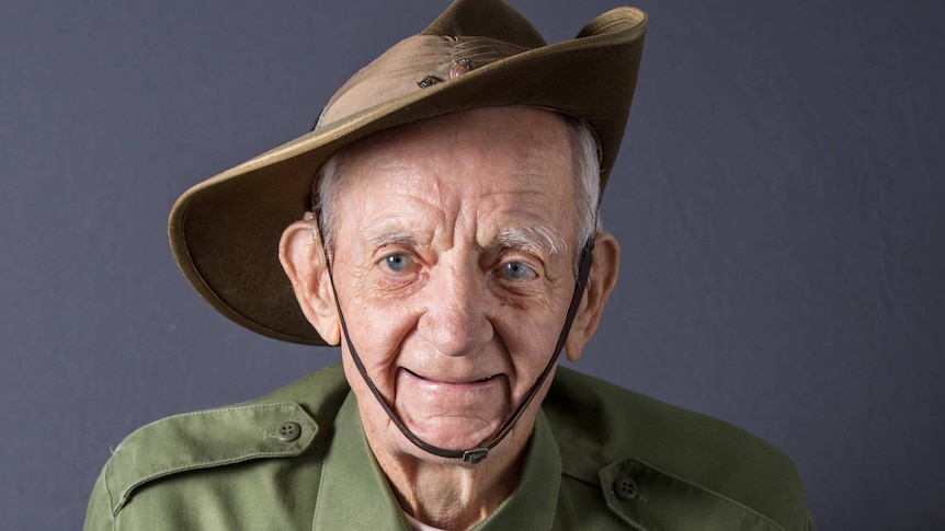 Portrait of an elderly man wearing war medals and army uniform