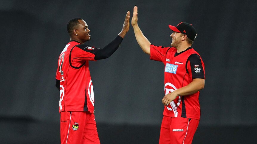 Marlon Samuels and Aaron Finch celebrate a wicket for the Melbourne Renegades.