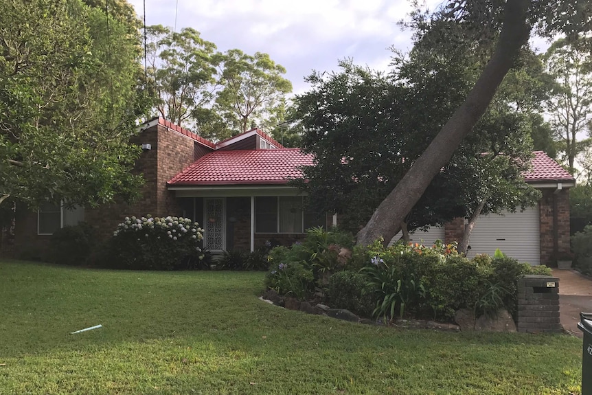 Front of former judge Richard Gee's brick house and yard