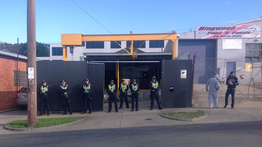 Police stand guard outside bikie clubhouse in Ringwood