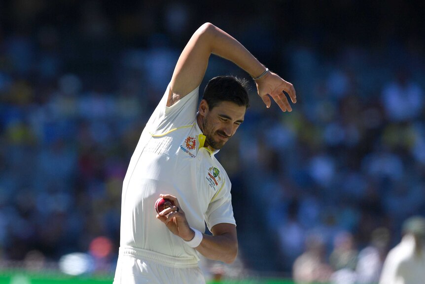 Micthell Starc stretches at the MCG