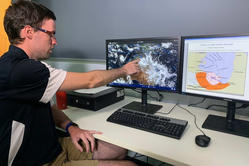 BOM's Bradley Wood points to an image of TC Esther on the computer screen.