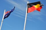 Australian and Aboriginal flying flags side-by-side.