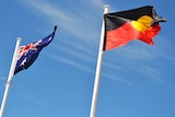 Australian and Aboriginal flying flags side-by-side.
