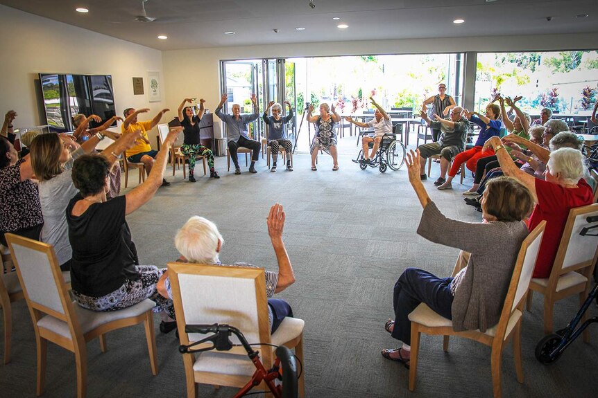People take part in dance class for the elderly and people with a disability on Queensland's Sunshine Coast