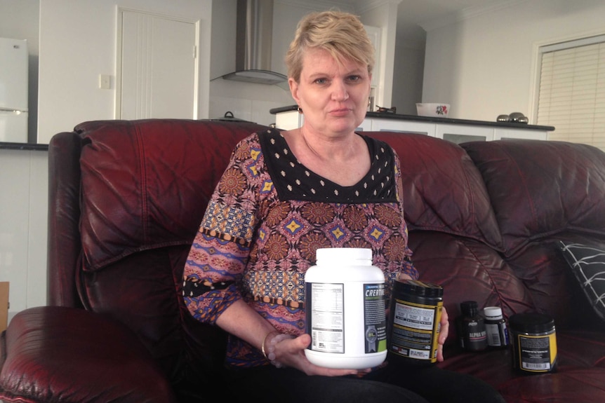Michelle White with bodybuilding supplements