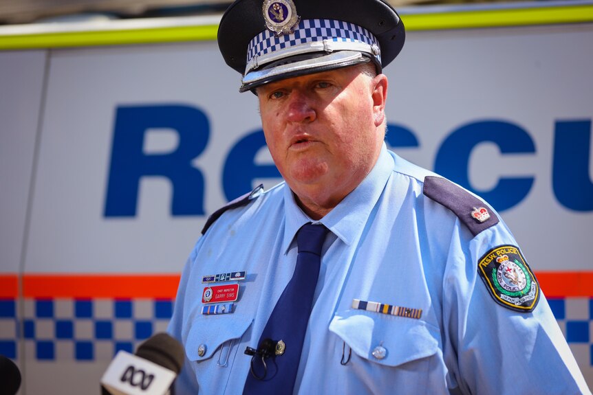 a police officer talking into a microphone