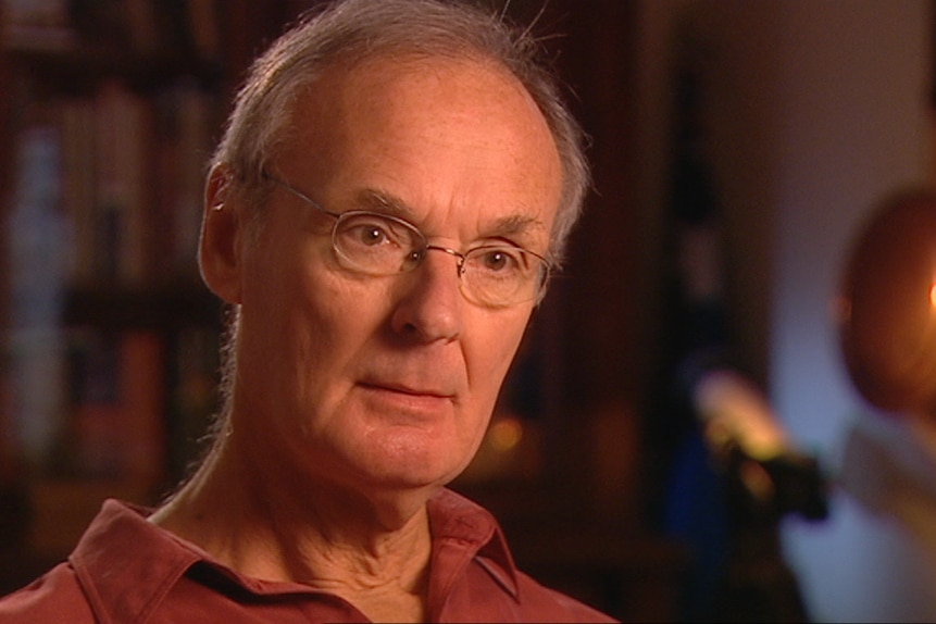 Jeff Watson is shown in an interview screenshot with production lighting and a blurred background