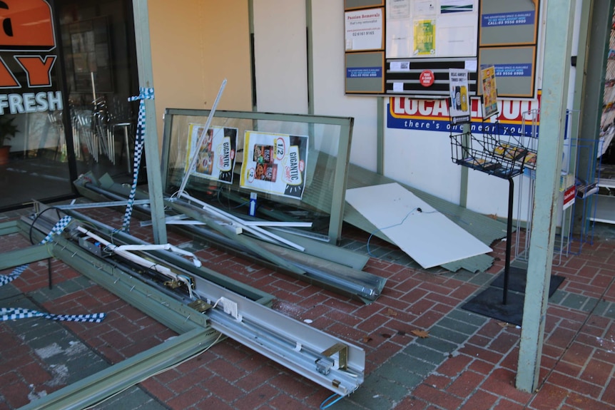 Parts of the store lie on the ground out the front of the IGA.