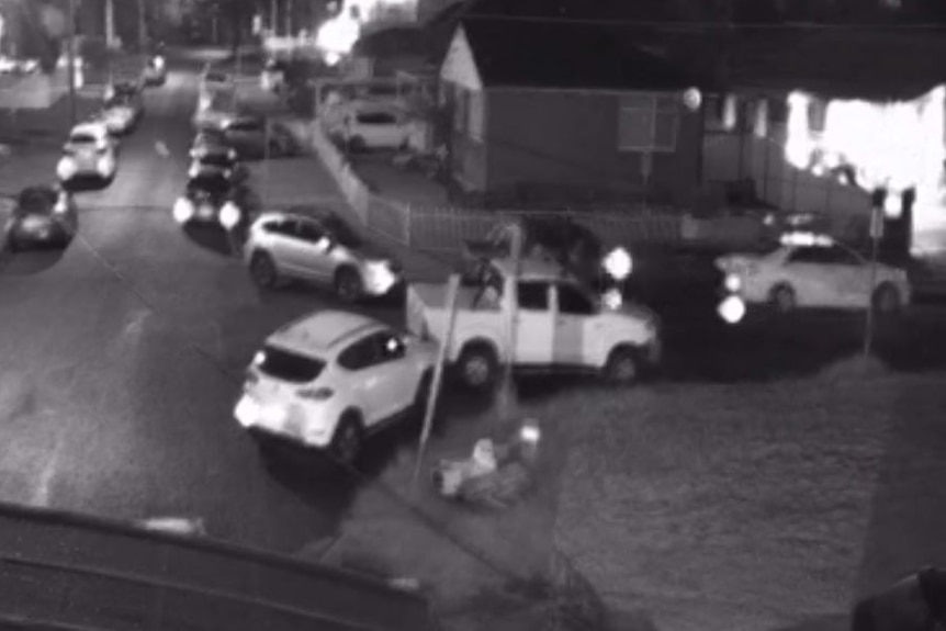 CCTV still showing cars on dark street