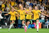 Mary Fowler, Sam Kerr, Caitlin Foord and Steph Catley of Australia celebrate the team’s victory
