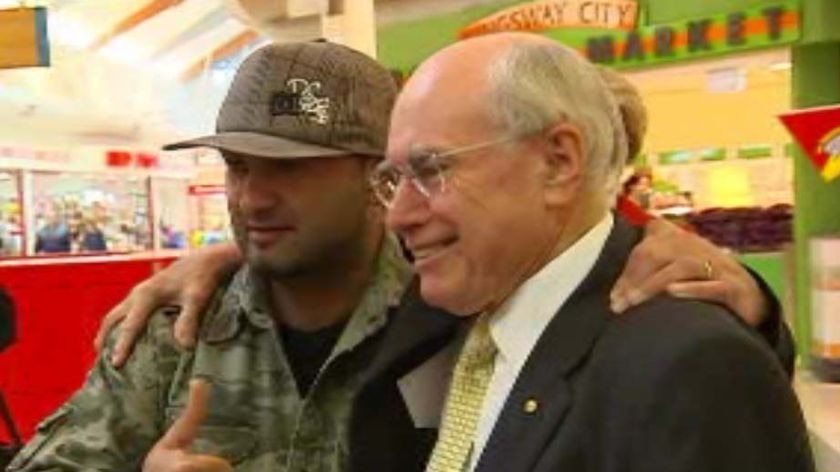 John Howard was happy to get photos taken with admirers at Kingsway shopping centre