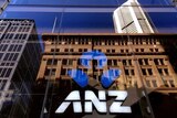 The logo of ANZ Banking Group is displayed in the window of a newly opened branch in central Sydney