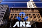 The logo of the ANZ Banking Group is displayed in the window of a newly opened branch in central Sydney