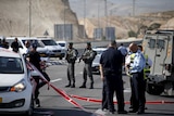 Israeli police officers stand guard at the scene of an attempted car ramming attack in the West Bank.
