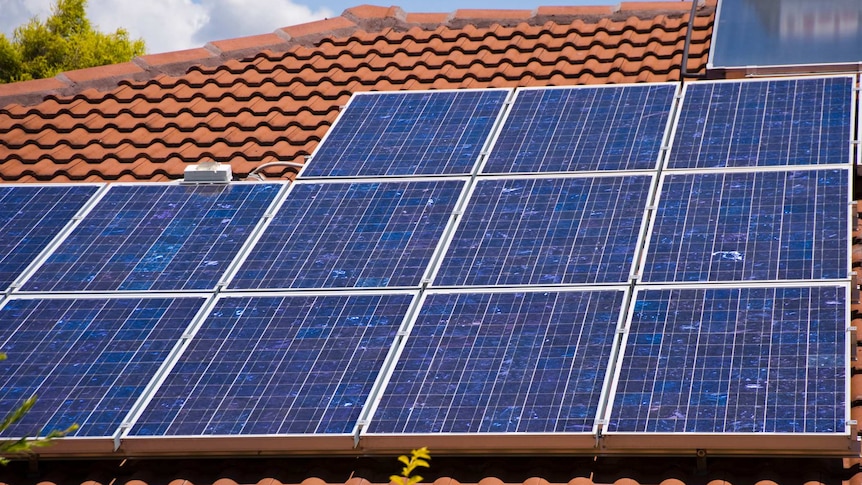 Close up of solar panels on a tiled roof