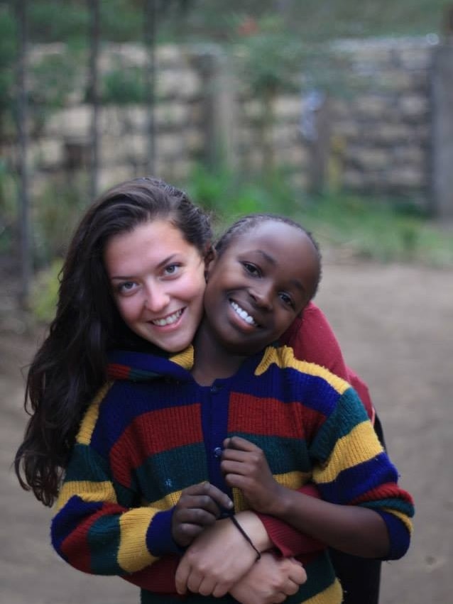 Ingrid Micallef hugs a child in Kenya during a trip in 2014.