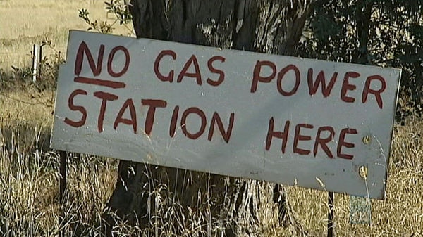 A sign saying 'no gas power station here'