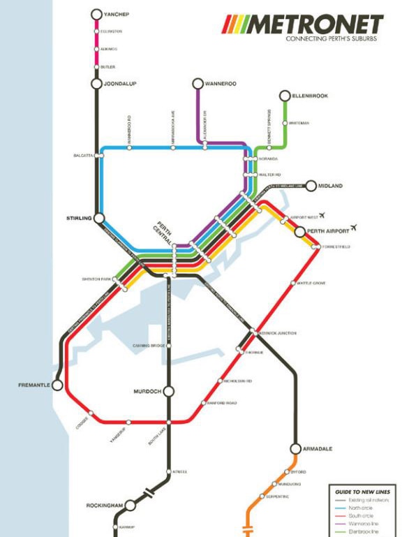 A man showing planned and existing rail lines under WA Labor's Metronet plan.