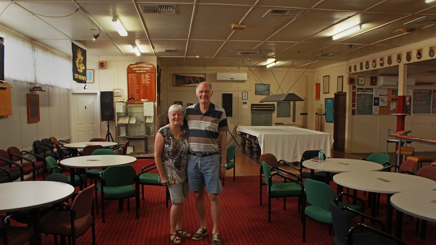 Husband and wife Gordon Murray and Marion standing next to each other inside the old Clermont RSL