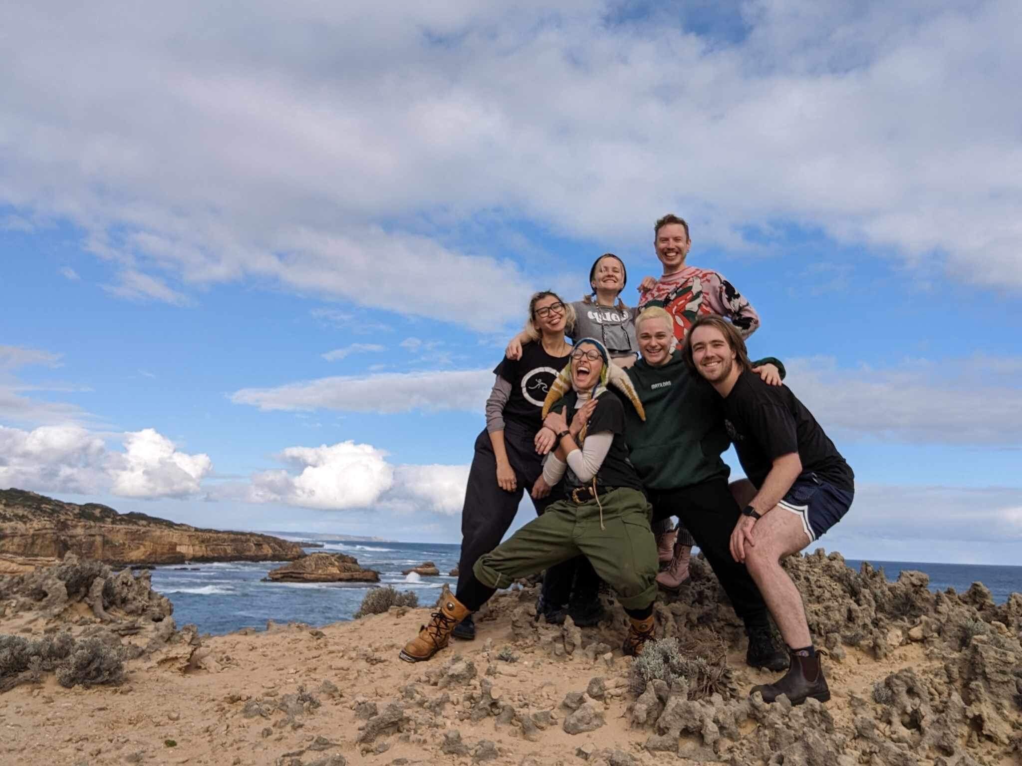 Patrick Lenton and friends pose at the beach.