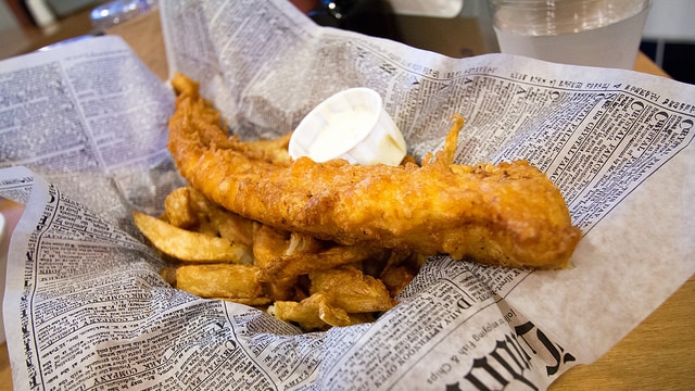 fish and chips in a news paper basket