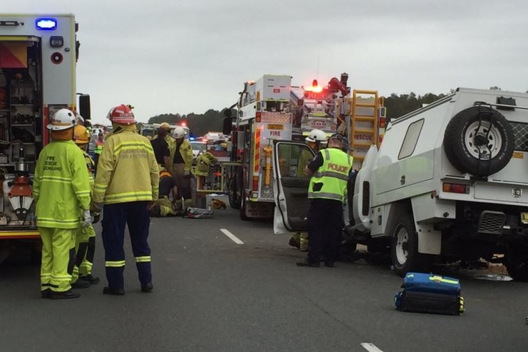 One person has died and 10 people have been injured in a multi-vehicle crash on the Bruce Highway