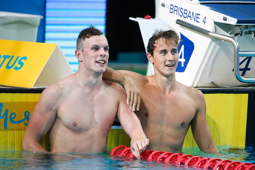 Cameron McEvoy (R) and Kyle Chalmers after the 100 metres freestyle final at the national titles.