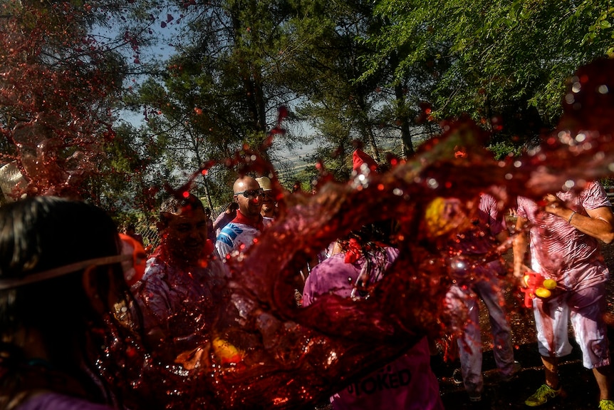 People take part in a wine battle, in the small village of Haro, northern Spain, Saturday, June 29, 2019.