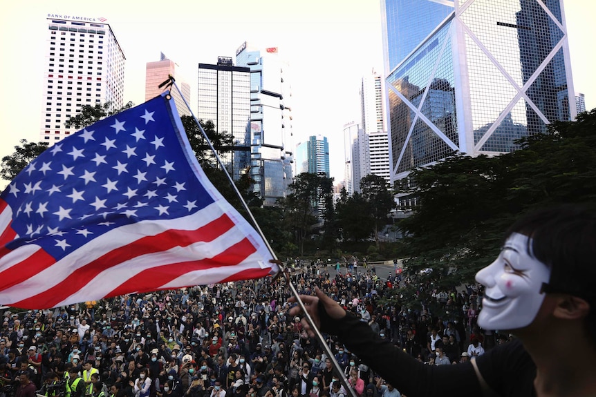 A protester waves an American flag during a rally in Hong Kong.