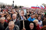 People attend a rally marking the fourth anniversary of Russia's annexation of Crimea