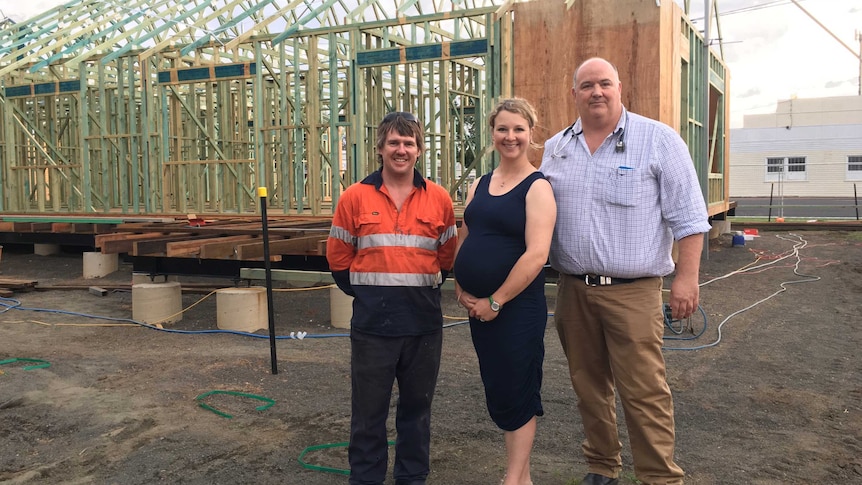 Builder with Luke and Kimberly Dwyer standing in front of build.