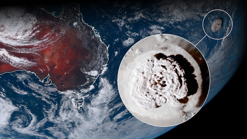 A satellite image showing Australia, New Zealand and an enormous mushroom cloud from a volcanic eruption in the Pacific ocean