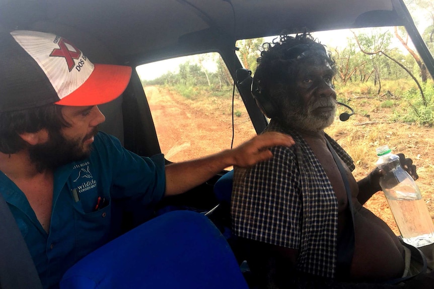 Robert Dutchie sits in a helicopter after being rescued.