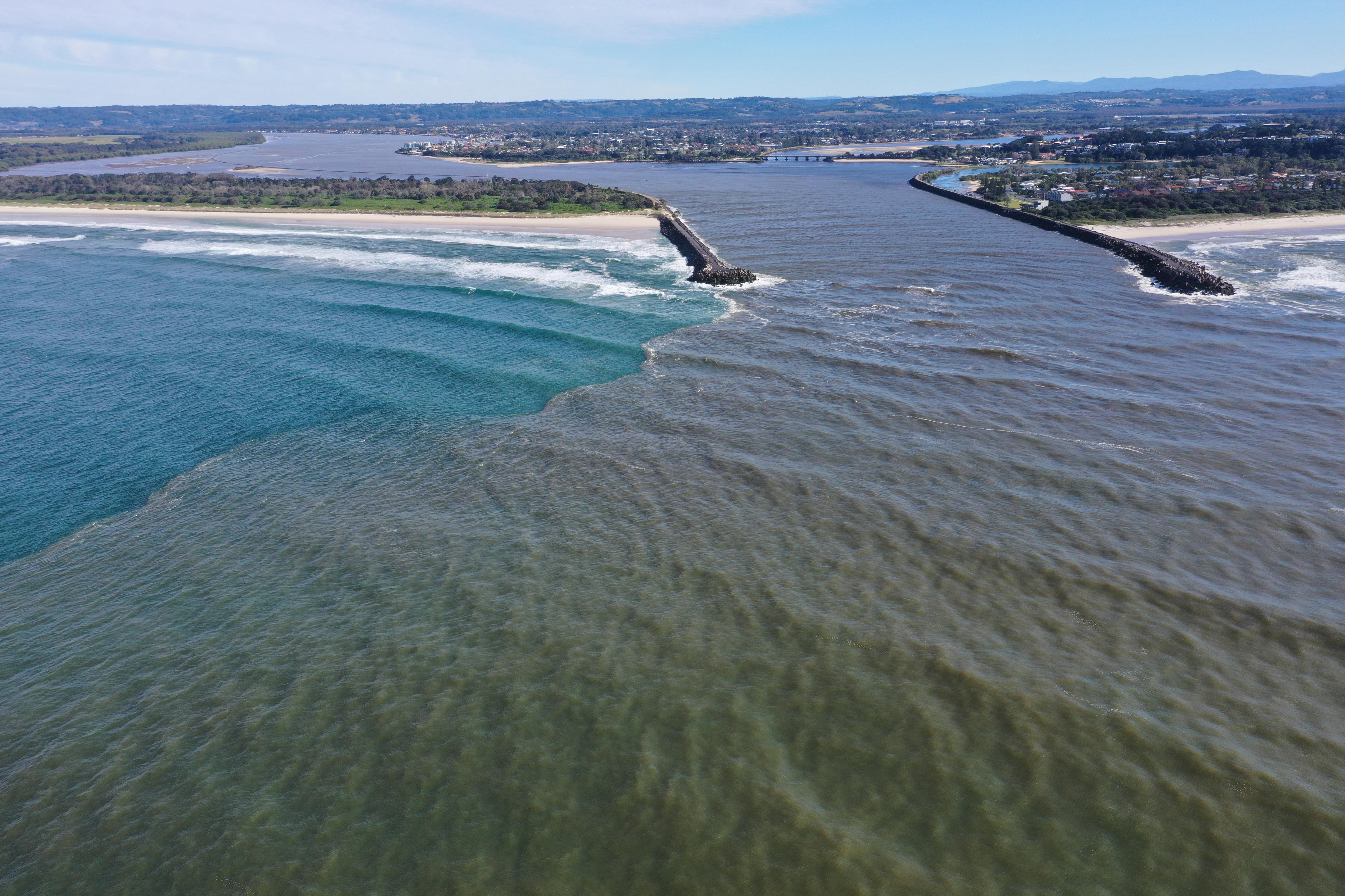 There's a line between dirty and clean water as it comes out into the ocean.