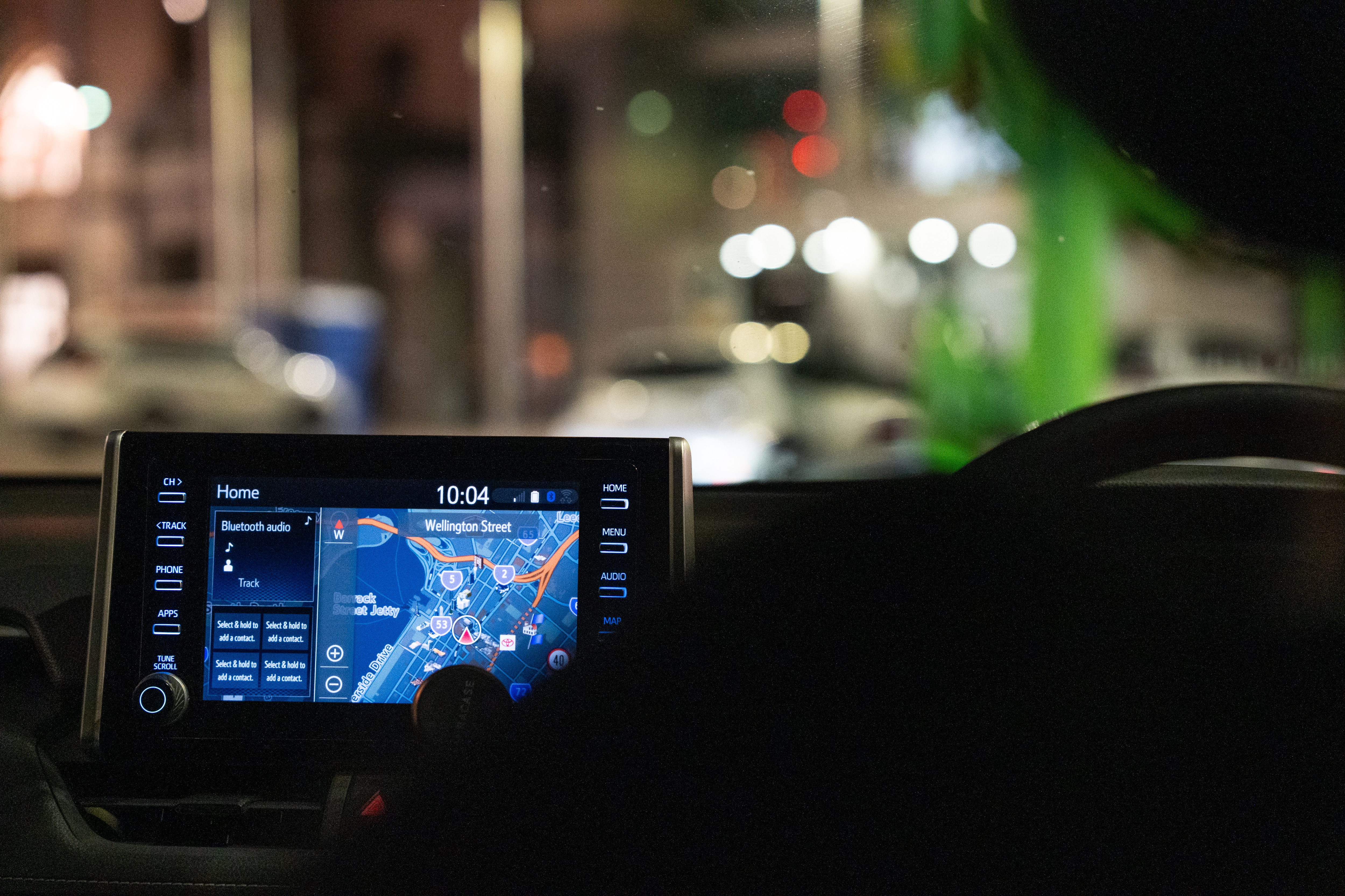 A screen showing a map of Perth's city centre is seen inside a car
