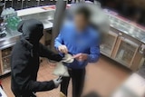CCTV shows a man robbing a Canberra club