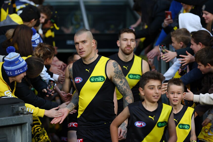 Dustin Martin greets fans ahead of his 300th game