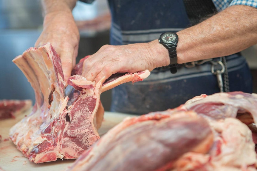 Neville Parker working on a carcass.