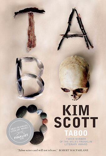 Book cover with the word 'taboo' spelt out with a variety of items including pebbles, twigs and a skull.