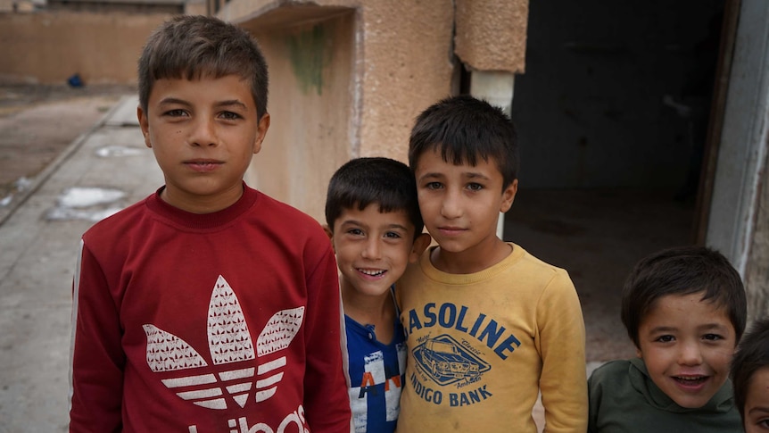 A group of little boys standing together