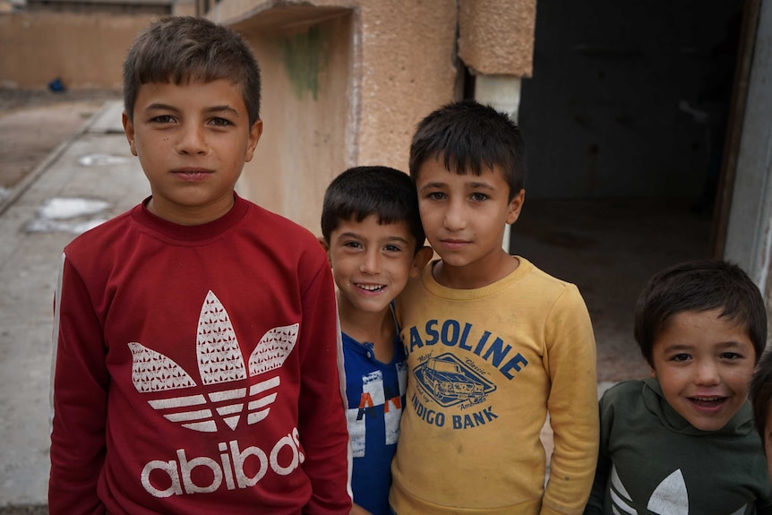 A group of little boys standing together