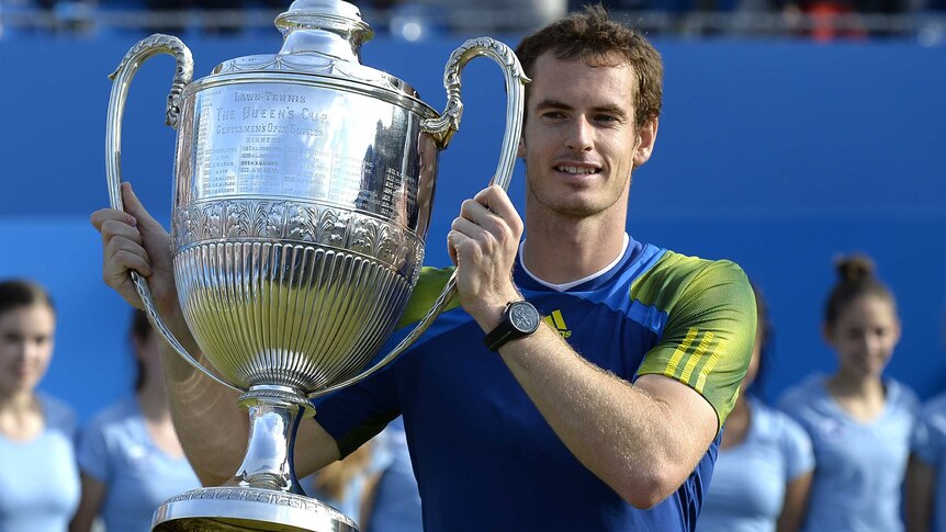 Andy Murray lifts the Queen's trophy