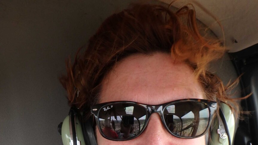 A selfie of Michelle Johnston in a helicopter.