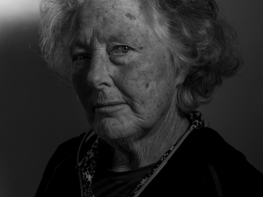 Portrait of an elderly woman in black and white.